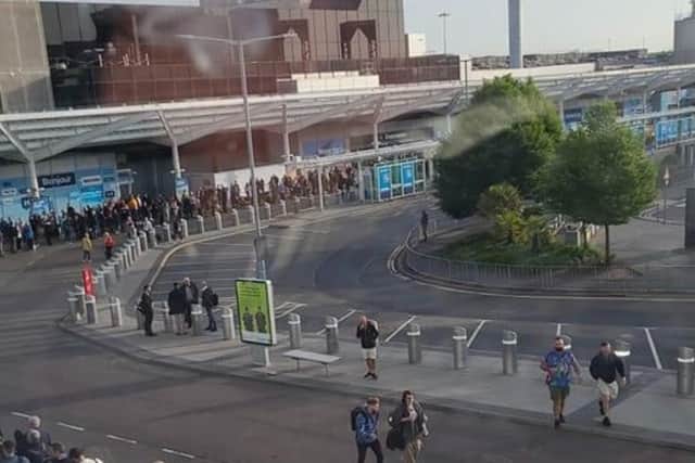 Queues outside the terminal at Birmingham Airport this morning