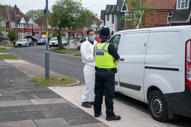 Forensic teams search the property for evidence