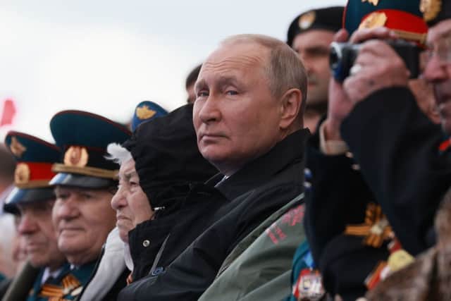 Russian President Vladimir Putin watches the Victory Day military parade at Red Square in central Moscow on May 9, 2022. (Photo by Mikhail METZEL / SPUTNIK / AFP) (Photo by MIKHAIL METZEL/SPUTNIK/AFP via Getty Images)