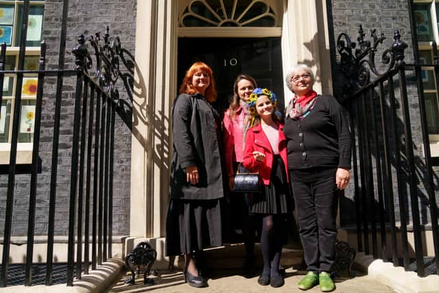 krainian refugee Melisa Kogut (second right), aged 11, stands with her family on the doorstep of 10 Downing Street after meeting with Prime Minister Boris Johnson, after they arrived to the UK through the UK visa scheme. During their meeting, Melisa sang a Ukrainian song to the Prime Minister. Picture date: Friday May 13, 2022.