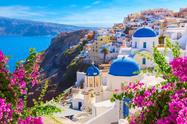 The island of Santorini is known for it’s stunning white washed houses that appear to balance on the cliff edges