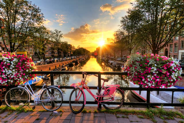 Amsterdam is known for its stunning canals and its elaborate cycle path network