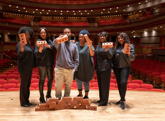 John Bernard and Black Voices on stage at Symphony Hall, ahead of their performance of Beyond the Bricks of Brum