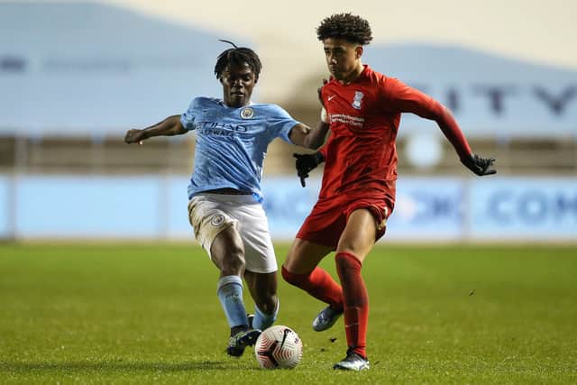 Romeo Lavia of Manchester United battles for possession with George Hall of Birmingham City during the FA Youth Cup match between Manchester City and Birmingham City at Manchester City Football Academy