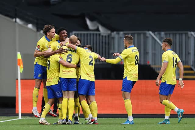 Kyle Hudlin of Solihull Moors celebrates with teammates after scoring their team’s first goal during the Vanarama National League Final match between Solihull Moors and Grimsby Town at London Stadium on June 05, 2022 in London, England. (Photo by Steve Bardens/Getty Images)