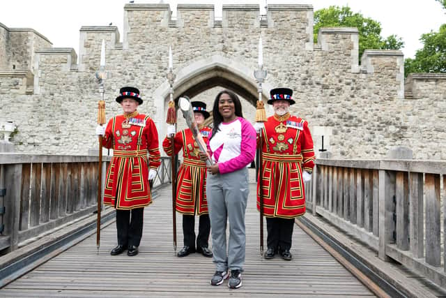 Batonbearer Tessa Sanderson CBE carries the Queen’s Baton during the Birmingham 2022 Queen's Baton Relay at the Tower of London