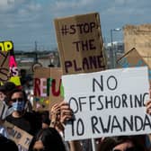 Protesters chant and hold placards against the UK deportation flights to Rwanda (Photo: Getty Images)