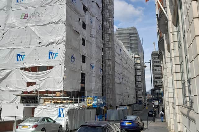 The apartments in Islington Gates remain covered in plastic sheeting while residents wait for building works to be completed