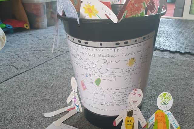 Fundraising bucket from Solihull brothers Bazzie and Joshua Hines who are raising funds in memory of Arthur Labinjo Hughes