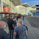 Passengers were forced to queue outside the terminal at Birmingham Airport on Tuesday morning (21 June)