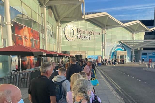Passengers were forced to queue outside the terminal at Birmingham Airport this morning (21 June)