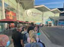 Passengers were forced to queue outside the terminal at Birmingham Airport on Tuesday morning (21 June)