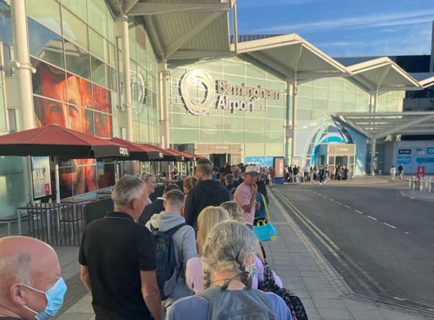 <p>Passengers were forced to queue outside the terminal at Birmingham Airport on Tuesday morning (21 June)</p>