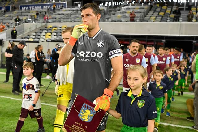 Emiliano Martinez of Aston Villa leads Aston Villa out onto the field during the 2022 Queensland Champions Cup match between Aston Villa and Brisbane Roar at Queensland Country Bank Stadium