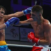 Niall Farrell of England in action against Olzhas Sattibayev of Kazakhstan