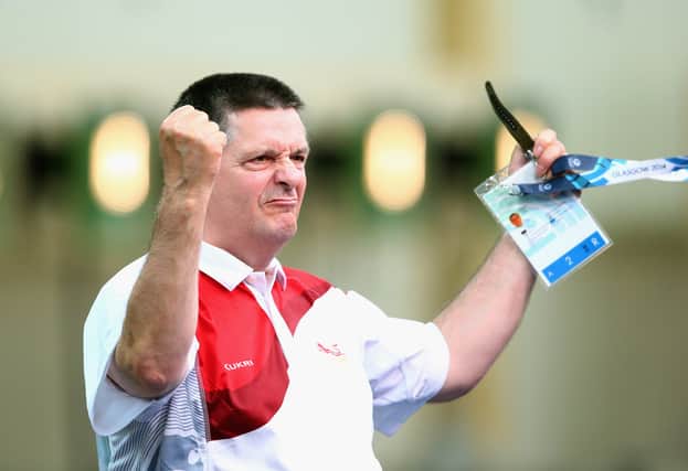 Michael Gault of England celebrates winning the Bronze Medal in the Men's 10m Air Pistol Shooting 
