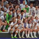 Players of England pose with the UEFA Women’s EURO 2022 Trophy after the final whistle of the UEFA Women’s Euro 2022 final match with Germany at Wembley Stadium on July 31, 2022