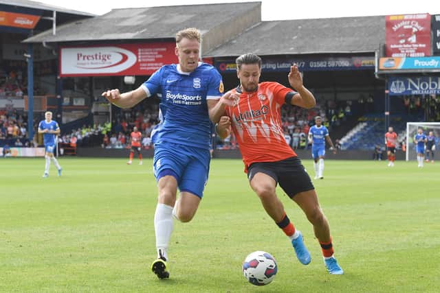 Harry Cornick of Luton Town is challenged by Marc Roberts of Birmingham City (Photo by Tony Marshall/Getty Images)