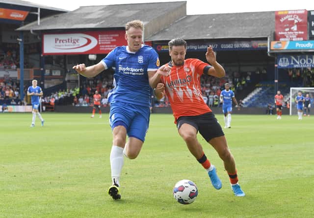 Harry Cornick of Luton Town is challenged by Marc Roberts of Birmingham City (Photo by Tony Marshall/Getty Images)