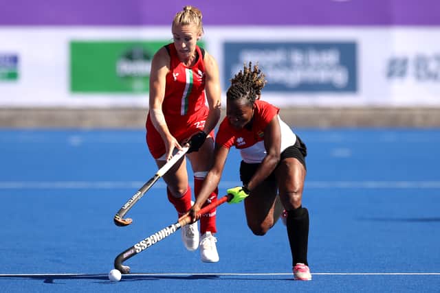 Cecilia Amoako of Team Ghana and Hannah Cozens of Team Wales compete during the Pool A - Women's Hockey Group Stage match between Team Wales and Team Ghana on day four of the Birmingham 2022 Commonwealth Games