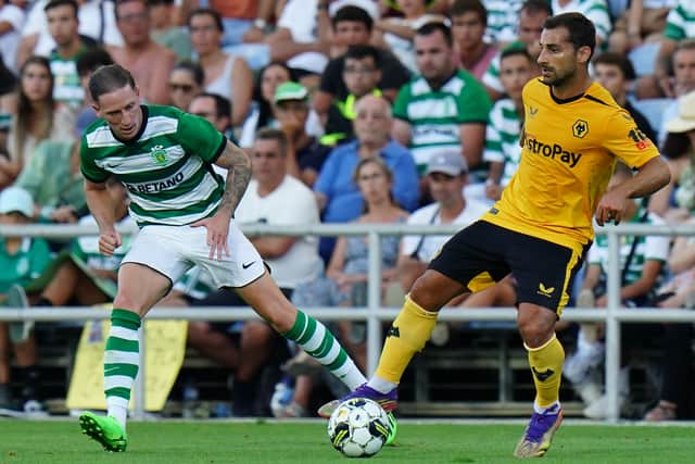 Jonny Otto of Wolverhampton Wanderers FC with Nuno Santos of Sporting CP in action during the Pre-Season Friendly match between Wolverhampton Wanderers and Sporting CP at Estadio Algarve