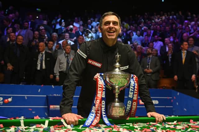 Ronnie O’Sullivan smiles after winning his 7th Snooker World Championship title at the Crucible