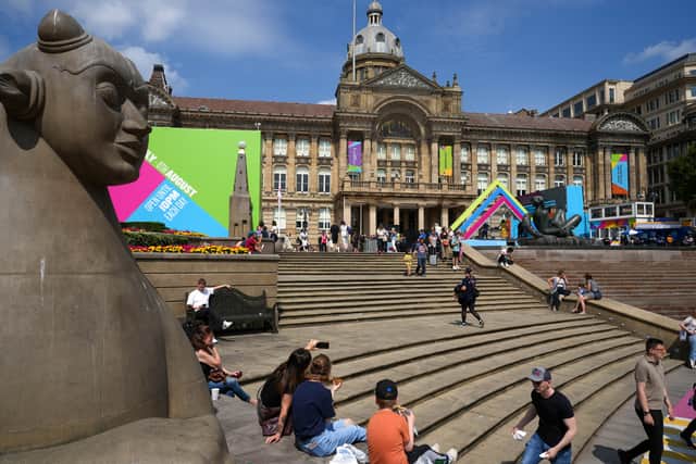 People relax in Victoria Square in the city centre during Day One of the Birmingham 2022 Commonwealth Games 