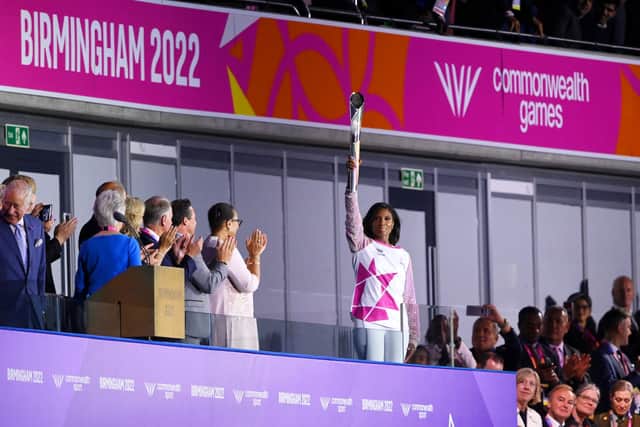  Denise Lewis carries the Queen's Baton during the Opening Ceremony of the Birmingham 2022 Commonwealth Games at Alexander Stadium