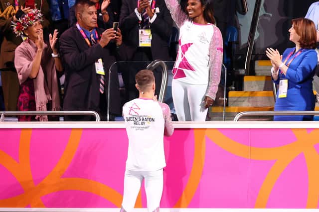 Denise Lewis carries the Queenâs Baton during the Opening Ceremony of the Birmingham 2022 Commonwealth Games at Alexander Stadium