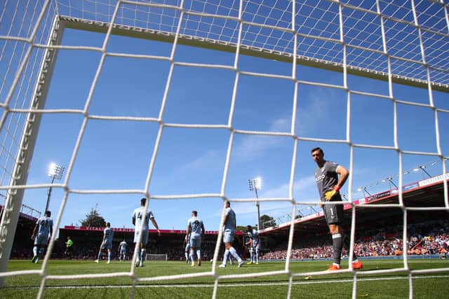Emiliano Martinez of Aston Villa reacts after their side concede a second goal scored by Kieffer Moore of AFC Bournemouth (not in picture) during the Premier League match between AFC Bournemouth and Aston Villa at Vitality Stadium