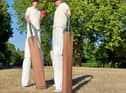 <p>Giant cricket players entertaining the crowd</p>