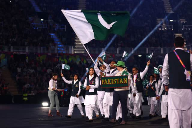 Flag Bearers of Team Pakistan leads their team out during the Opening Ceremony of the Birmingham 2022 Commonwealth Games at Alexander Stadium on July 28, 2022 on the Birmingham, England. (Photo by Elsa/Getty Images)