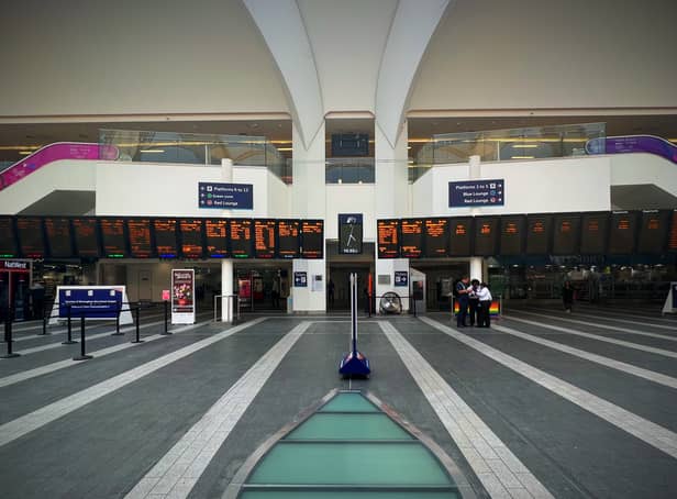 <p>Birmingham New Street empty concourse departure boards during June 2022 strikes</p>