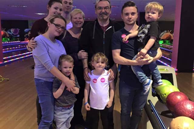 Aston Villa fan Andy Bright with his family after he recovered from lung disease