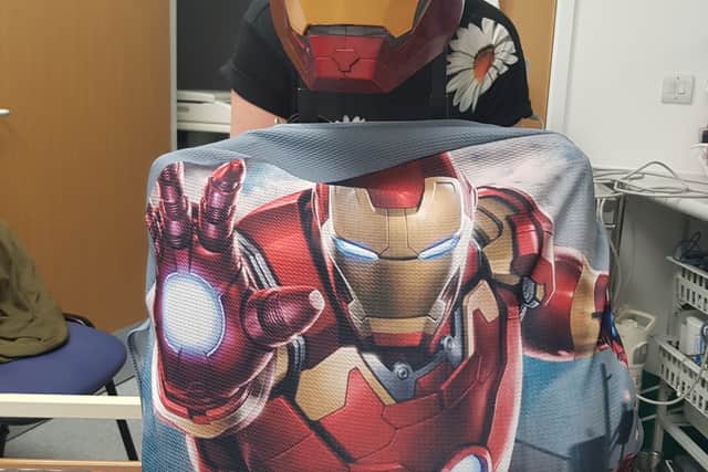 The iron man suitcase and mask Andy used to show his grandkids he was like a superhero