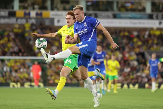 Marc Roberts of Birmingham City in action with Josh Sargent of Norwich City	  during the Carabao Cup First Round match between Norwich City and Birmingham City 