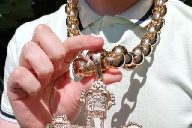 Hansons Auctioneers’ trainee valuer Daniel Armstrong wears the UK’s biggest gold crucifix which was bought in the Jewellery Quarter in Birmingham