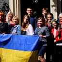 A number of Ukrainian families stand on the doorstep of 10 Downing Street after they met with Prime Minister Boris Johnson after arriving to the UK through the UK visa scheme.