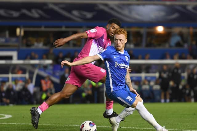 Ryan Woods of Birmingham City is challenged by Tino Anjorin of Huddersfield Town during the Sky Bet Championship between Birmingham City and Huddersfield Town at St Andrews
