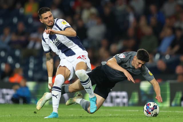 Okay Yokuslu of West Bromwich Albion is challenged by Callum O'Dowda of Cardiff City during the Sky Bet Championship between West Bromwich Albion and Cardiff City at The Hawthorns