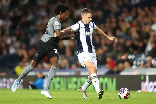 Conor Townsend of West Bromwich Albion is challenged by Jaden Philogene-Bidace of Cardiff City during the Sky Bet Championship between West Bromwich Albion and Cardiff City at The Hawthorns