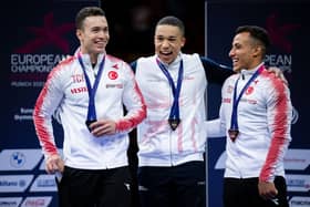 Great Britain’s Joe Fraser (centre) celebrates with his gold medal