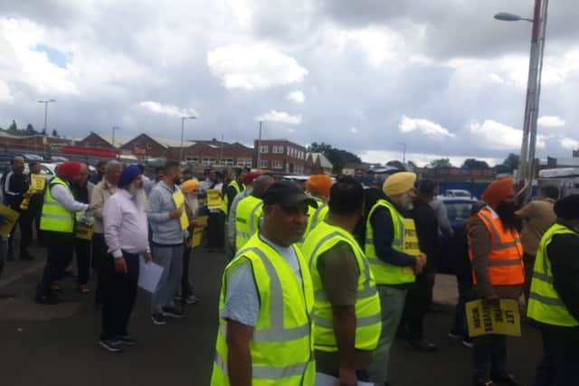 Taxi drivers in West Bromwich during a protest in June 2022