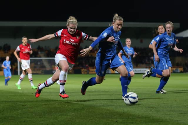 Kim Little of Arsenal battles with Laura Bassett of Birmingham City 