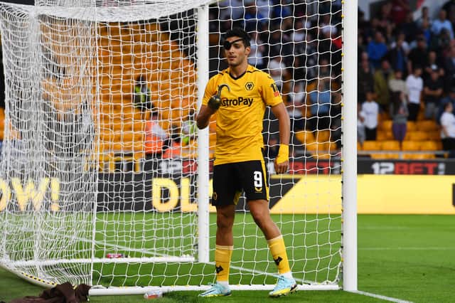 Raul Jimenez of Wolverhampton Wanderers scores their team's first goal while wearing eye patch and pirates hook during the Carabao Cup Second Round match between Wolverhampton Wanderers and Preston North End at Molineux