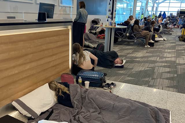 Passengers at L.F. Wade International Airport in St.George’s, Bermuda, after their American Airlines flight from Miami to London had to divert due to a possible mechanical issue