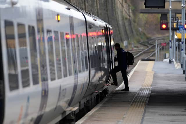 A customer steps onto a Northern train – the train operator has announced a flash sale to keep the summer holiday feeling going