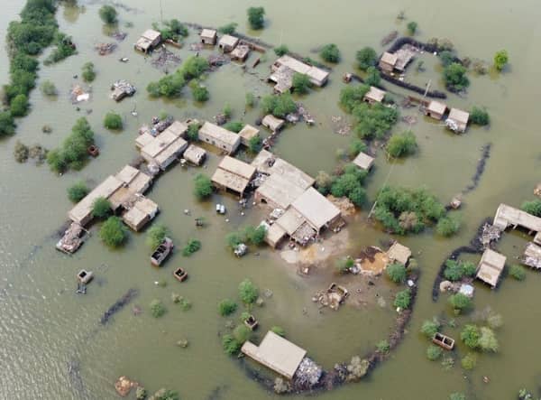 This aerial view shows a flooded residential area in Dera Allah Yar town after heavy monsoon rains in Jaffarabad district, Balochistan province on August 30, 2022. (Photo by FIDA HUSSAIN/AFP via Getty Images)