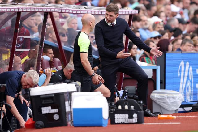 Steven Gerrard, Manager of Aston Villa interacts with Fourth Official, Anthony Taylor during the Premier League match between Aston Villa and West Ham United at Villa Park