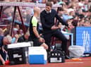 Steven Gerrard, Manager of Aston Villa interacts with Fourth Official, Anthony Taylor during the Premier League match between Aston Villa and West Ham United at Villa Park